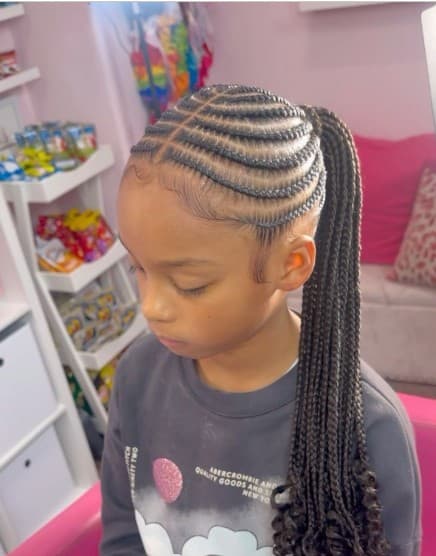 Kids cornrow ponytail with curled ends