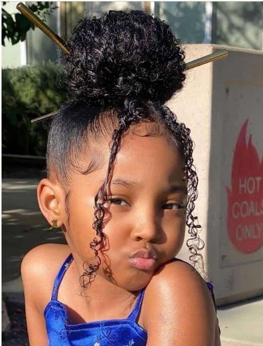 Kids puff bun with gold hair sticks